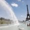People cool off in the Trocadero fountains across from the Eiffel Tower in Paris as a heatwave hit much of the country