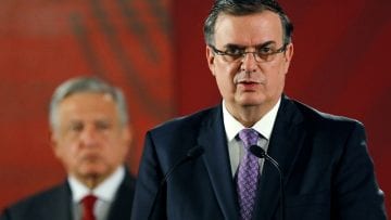 Mexican Foreign Minister Marcelo Ebrard speaks during a news conference as Mexican president Andres Manuel Lopez Obrador looks on, at National Palace in Mexico City
