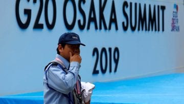 A security officer walks past at the venue of G20 leaders summit in Osaka, western Japan