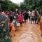 Villagers carry their belonging as they evacuate after the Xepian-Xe Nam Noy hydropower dam collapsed in Attapeu province